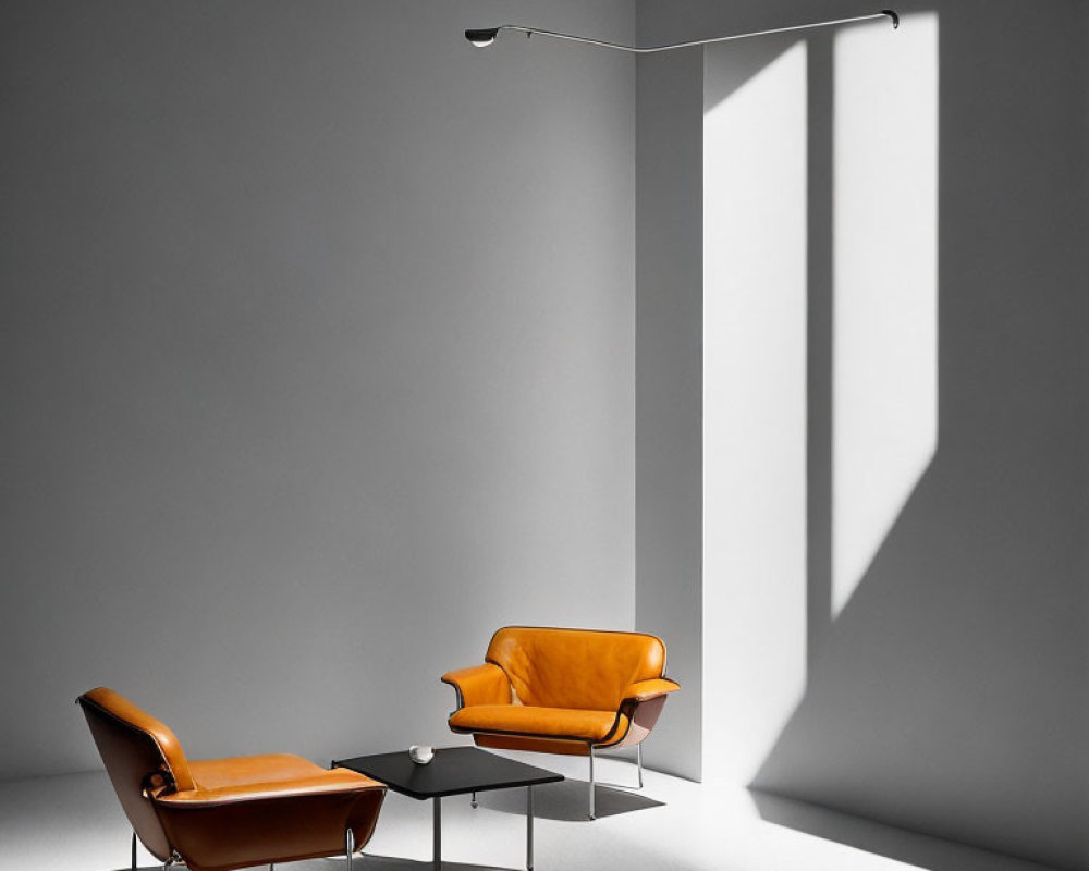 Modern orange chairs, black coffee table, and floor lamp in minimalist grey room