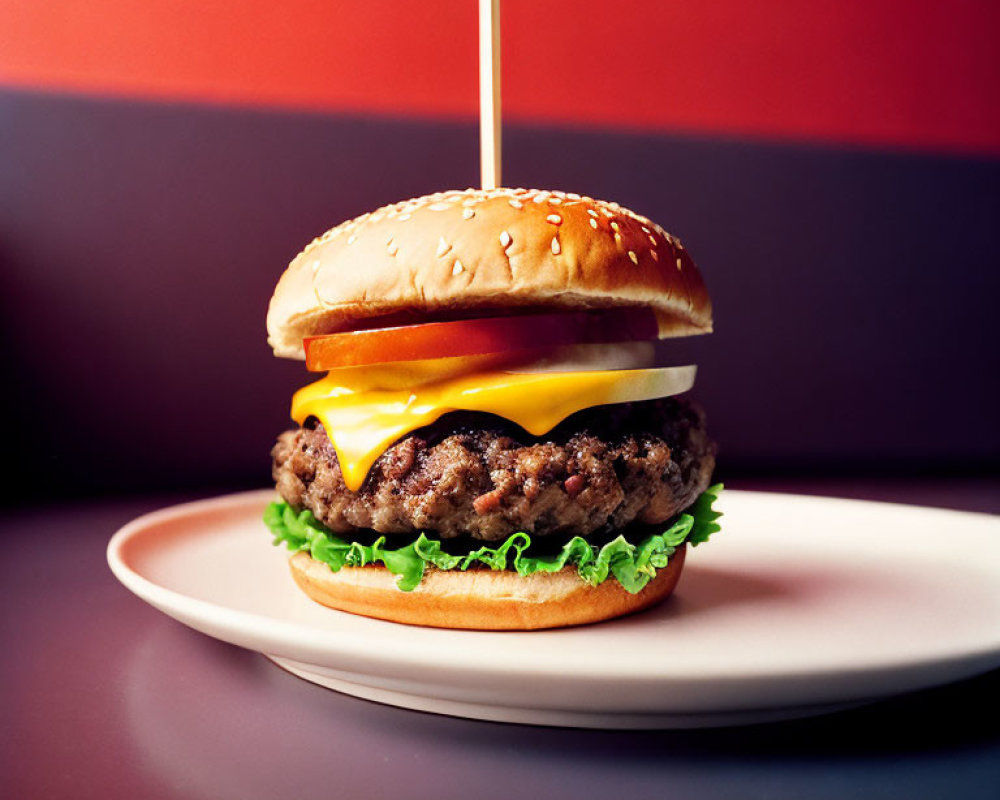 Cheeseburger with lettuce and cheese on sesame seed bun, red and purple backdrop