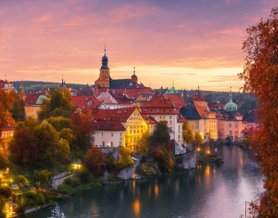 European town sunset with castle, river, and autumn foliage