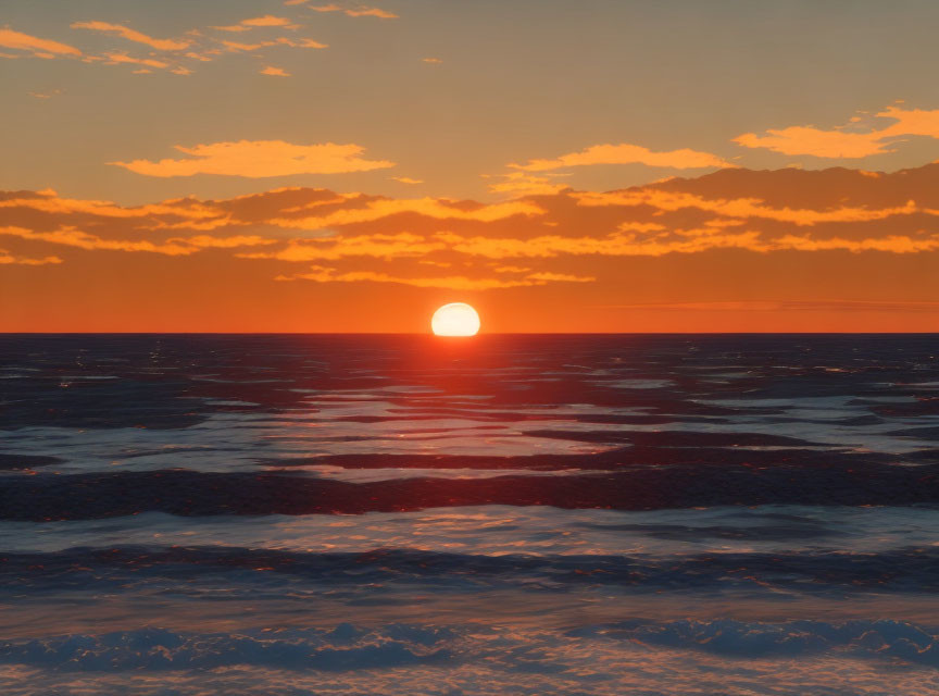 Tranquil Ocean Sunset with Large Sun Setting