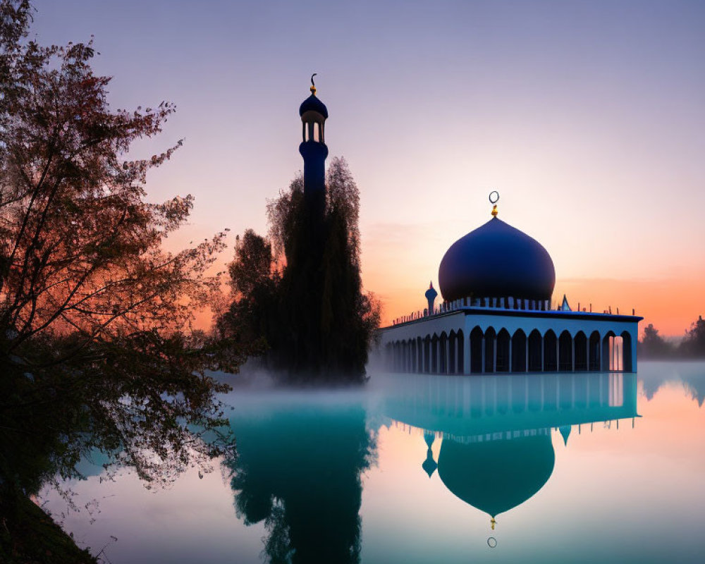 Blue-domed mosque and minaret by calm lake at sunrise or sunset