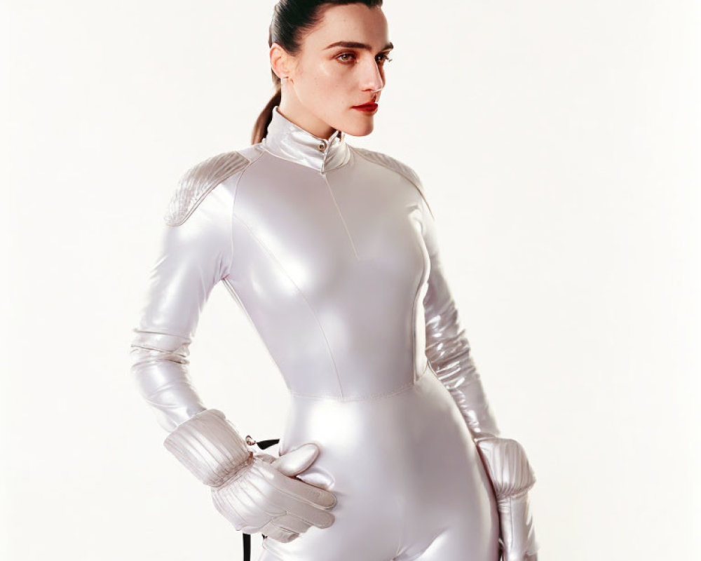 Futuristic silver bodysuit woman with shoulder padding and red lipstick