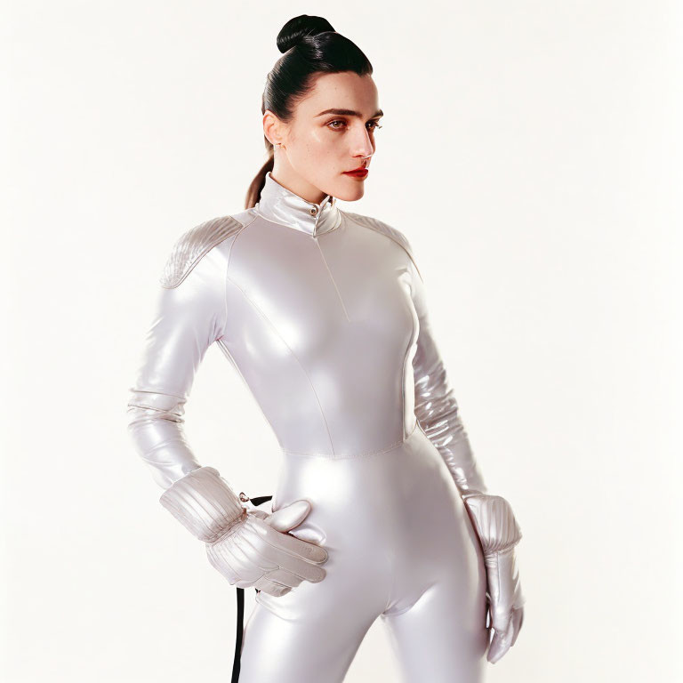 Futuristic silver bodysuit woman with shoulder padding and red lipstick