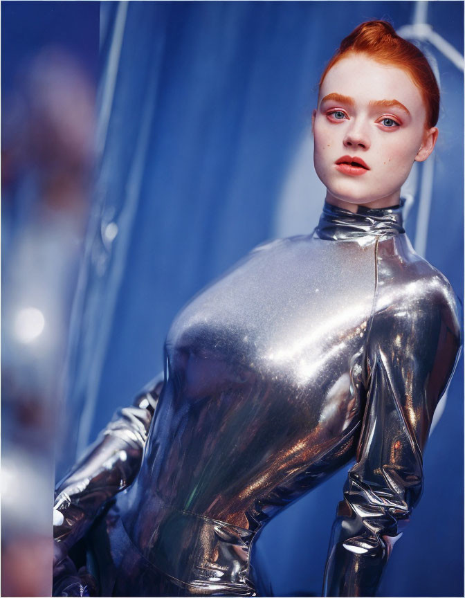 Striking Red Hair and Bold Makeup in Silver Bodysuit Pose