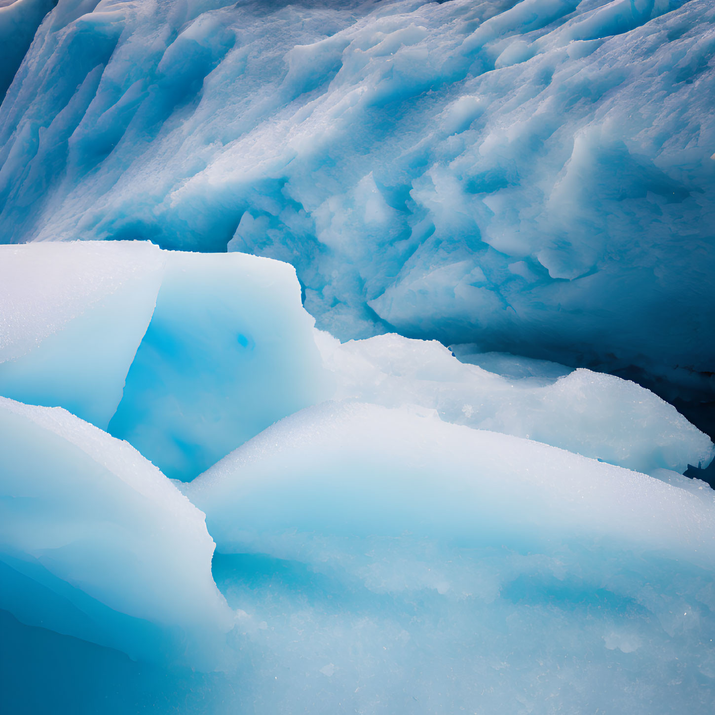 Detailed close-up of vivid blue and white glacial ice formation