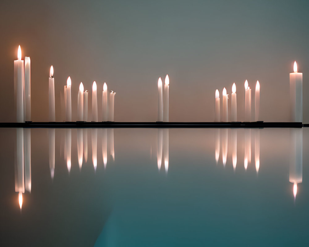 Row of Lit Candles Reflecting on Glossy Surface Against Blue Gradient Background