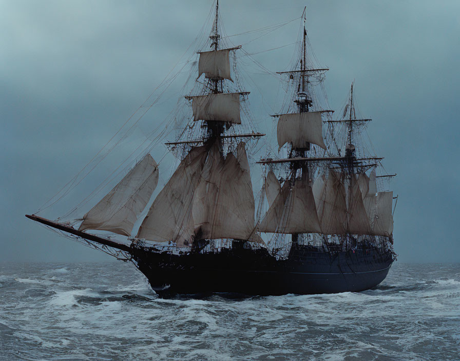 Traditional sailing ship with multiple masts in stormy seas