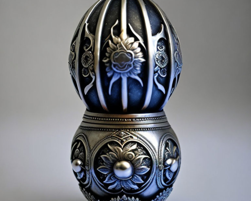Intricate Black & Silver Floral Decorative Egg on Grey Background