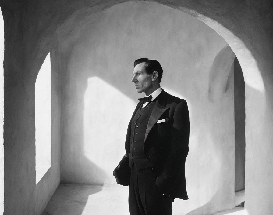 Man in Classic Tuxedo in Dramatic Architectural Setting