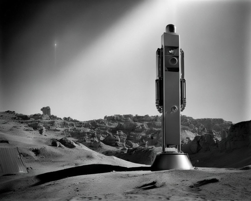 Monochromatic photo: panoramic camera in rocky desert with visible star.