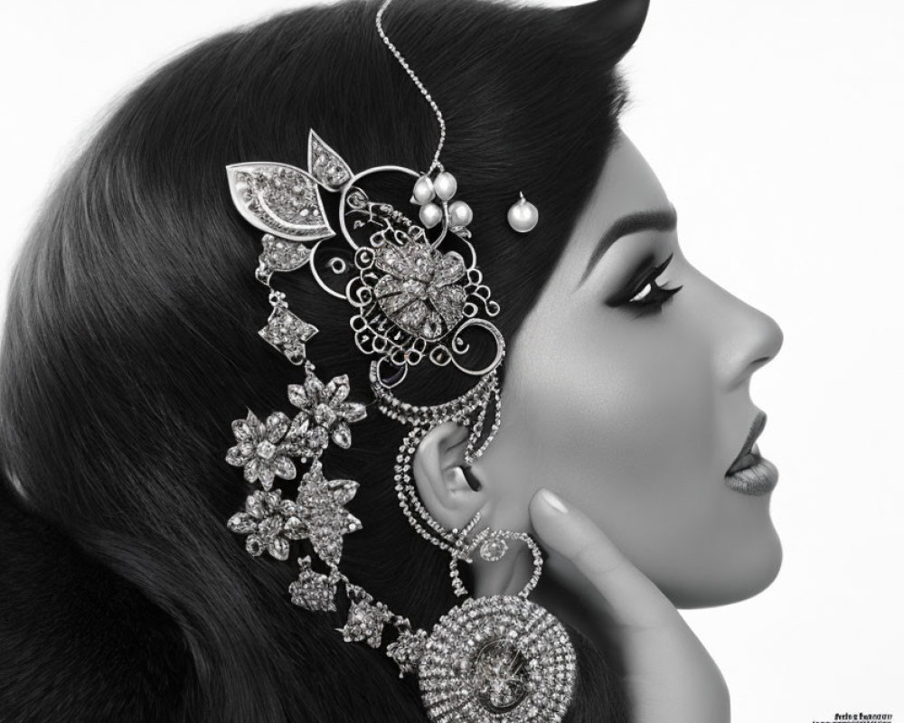 Monochrome side profile of woman with elegant jewelry