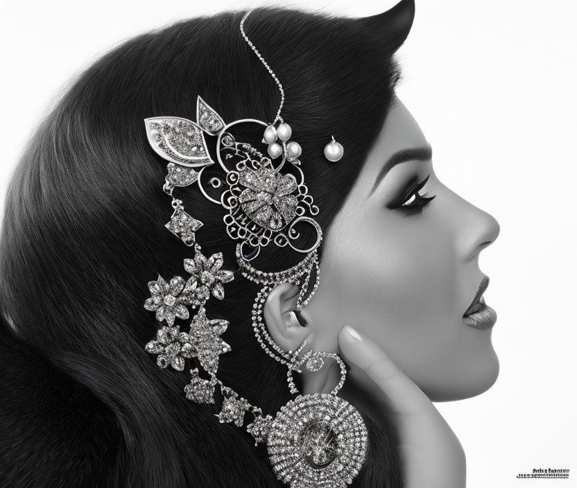 Monochrome side profile of woman with elegant jewelry