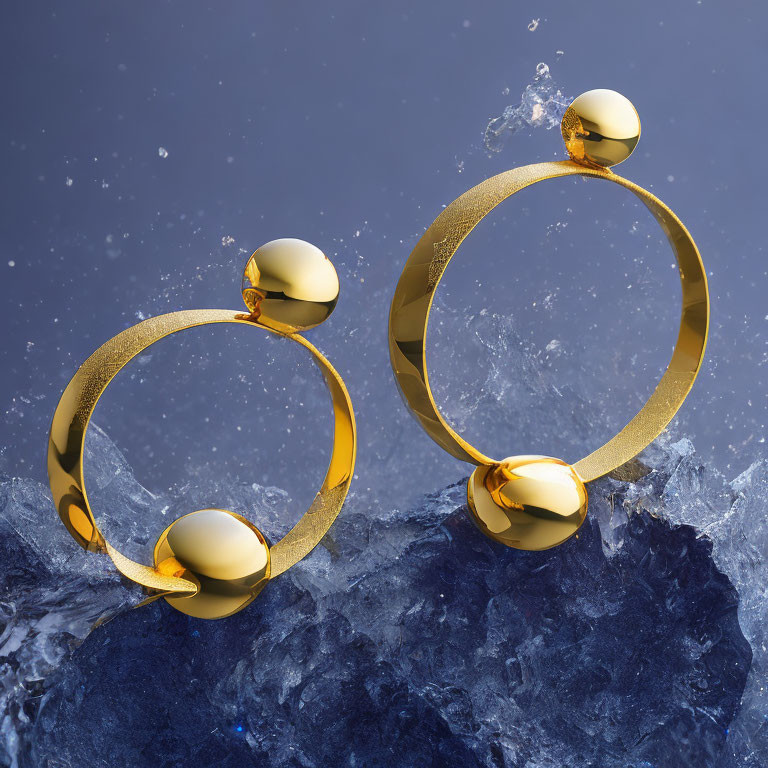 Golden Hoop Earrings with Spherical Embellishments in Water Splash Photo