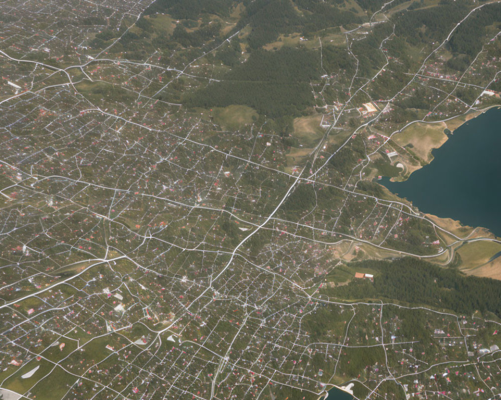 Dense Urban Area with Waterfront and Forested Hills