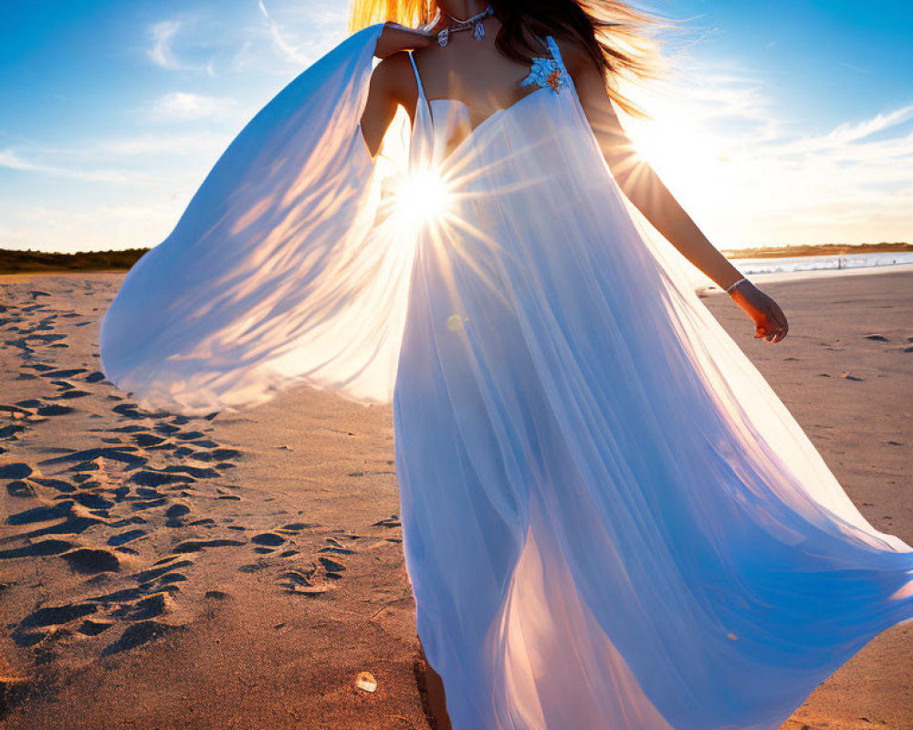 Woman in White Dress on Sandy Beach at Sunset