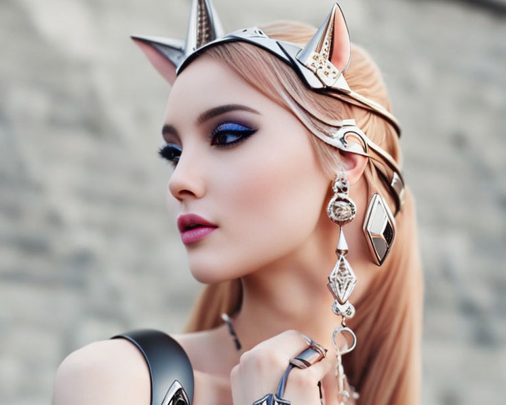 Striking makeup and avant-garde cat ears headdress with silver jewelry