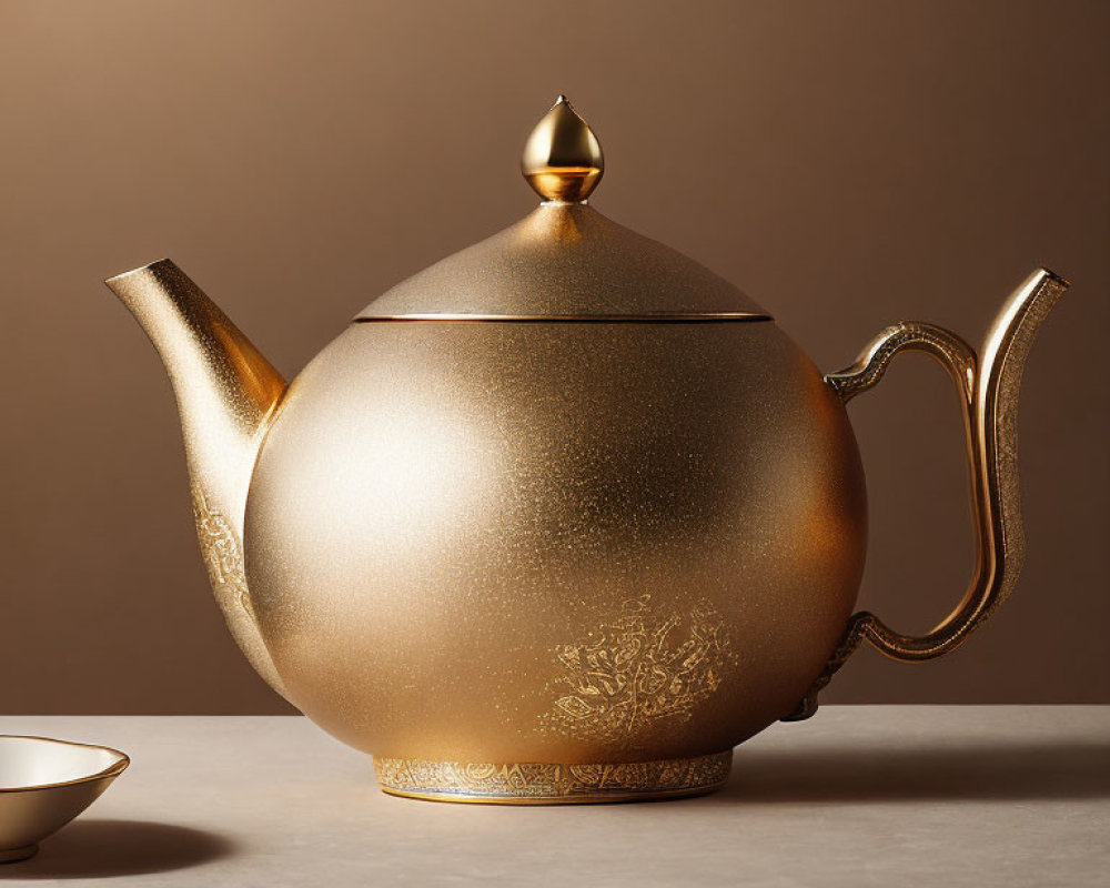 Golden teapot with intricate textures and glossy finish on neutral backdrop