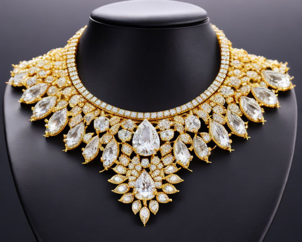 Luxurious Gold and Diamond Necklace with Teardrop and Round Jewels on Black Bust