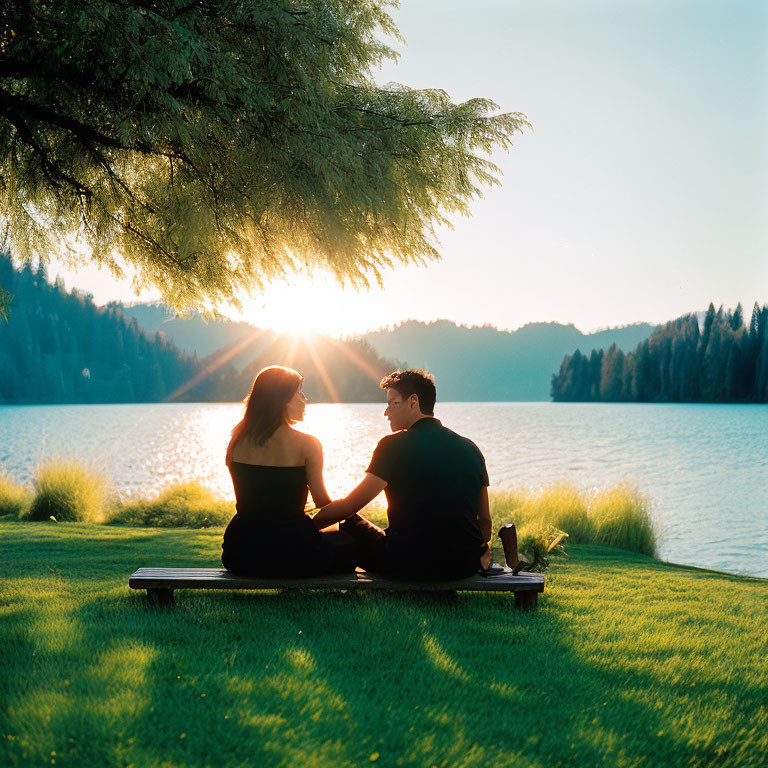 Couple holding hands by serene lake at sunset