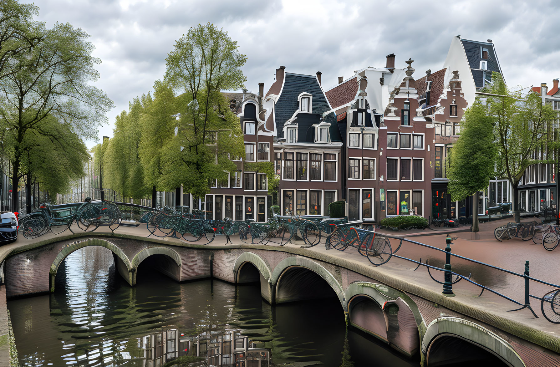 Tranquil Dutch canal with traditional houses, bicycles, and green trees
