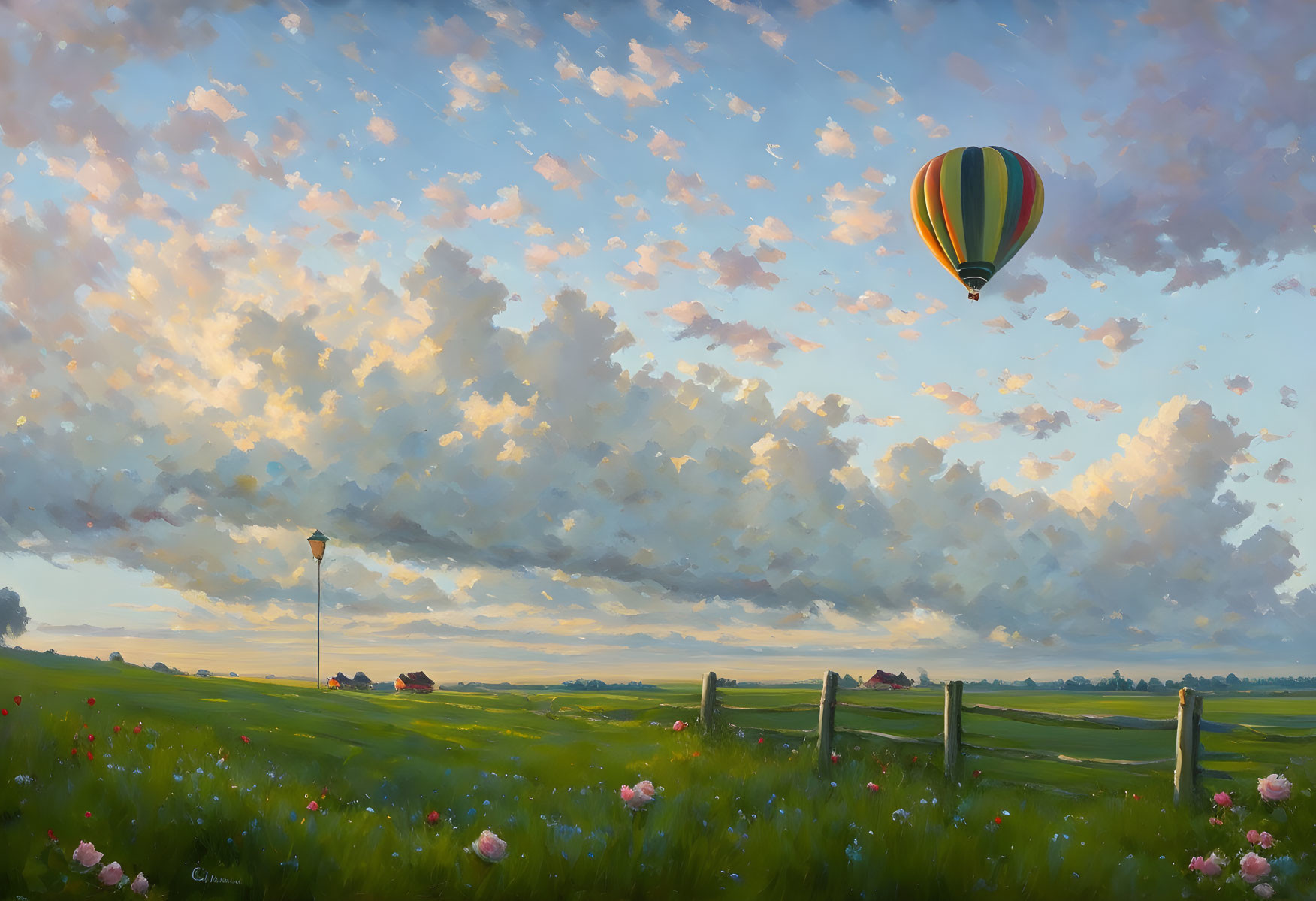 Tranquil landscape with hot air balloon over green field at sunset