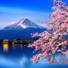 Twilight view of Mount Fuji with cherry blossoms, pagoda, and birds