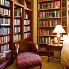 Floor-to-ceiling wooden bookshelves in a cozy home library