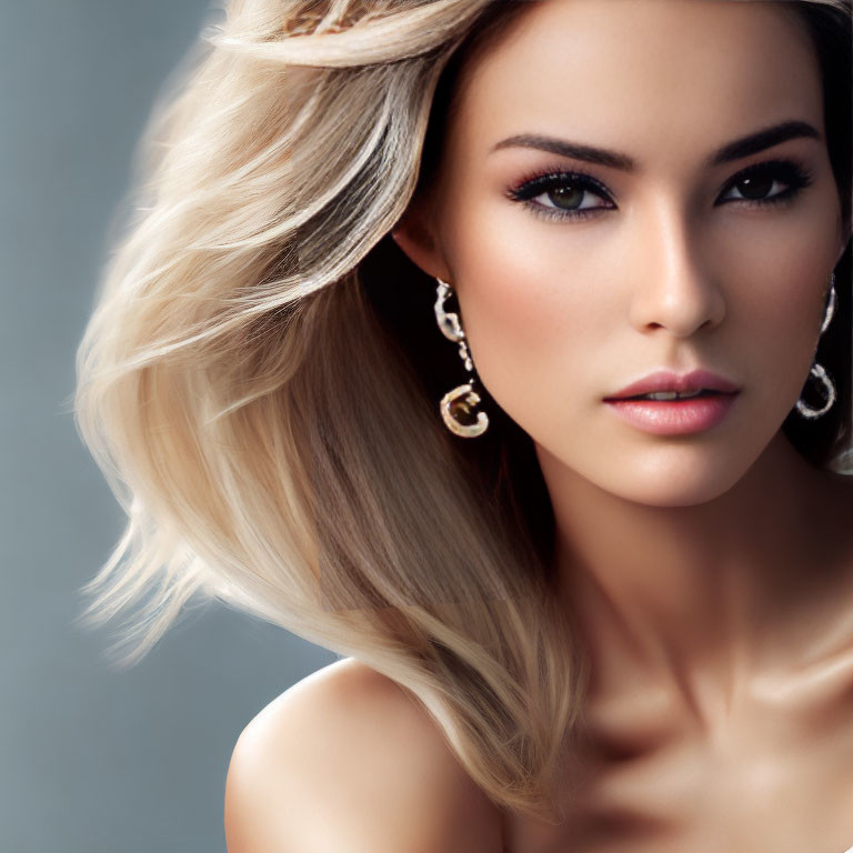 Blonde woman portrait with flowing hair and elegant earrings