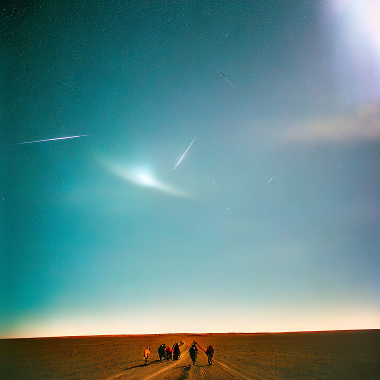 Group of People Under Starry Sky with Meteor Trails on Vast Twilight Landscape
