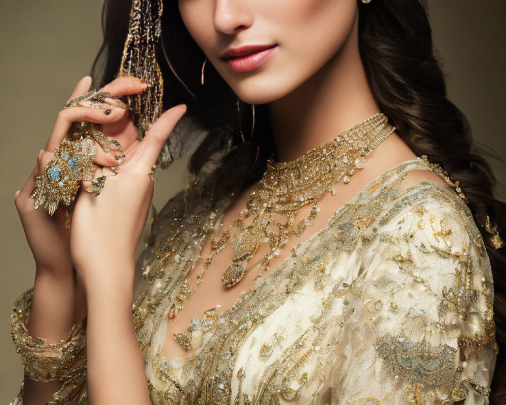Luxurious Gold Jewelry and Embroidered Outfit on Elegant Woman
