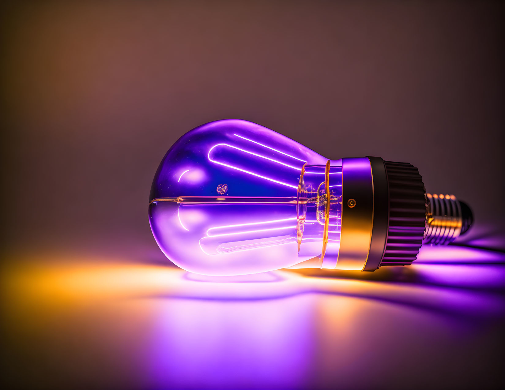 Purple Glowing Light Bulb on Warm Gradient Background
