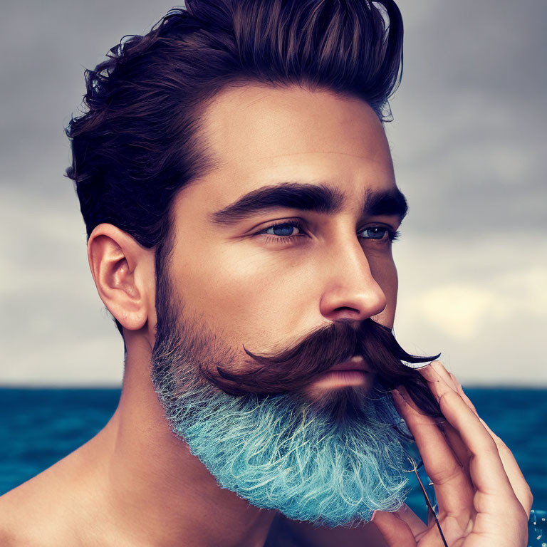 Man with Sculpted Facial Hair and Blue Ombre Beard in Stormy Sea Setting
