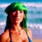 Smiling person with green hair on beach with ocean and rock formation