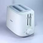 Silver Toaster with Water Pouring Out on Blue Misty Background