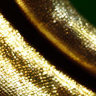 Shiny golden textured surface with sparkling reflections on dark green background