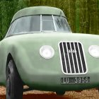 Vintage Green Car with Round Headlights and Front Grille on Whimsical Background