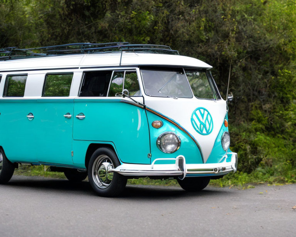 Vintage turquoise and white Volkswagen Type 2 bus on forest road