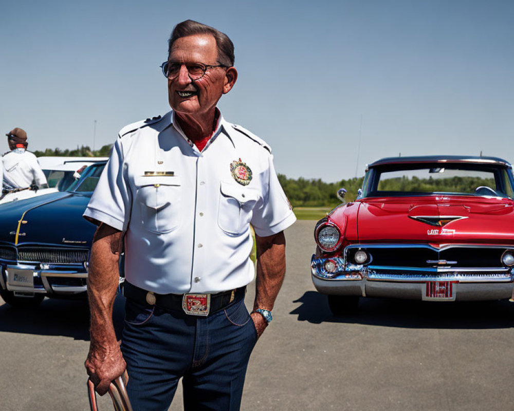 Elderly gentleman in white firefighter uniform with vintage cars and clear blue sky