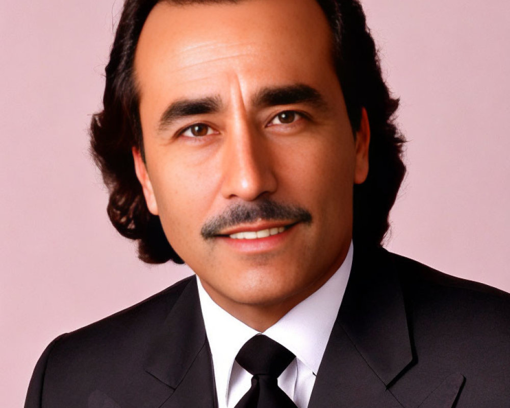 Man with Mustache in Black Suit and Tie on Pink Background