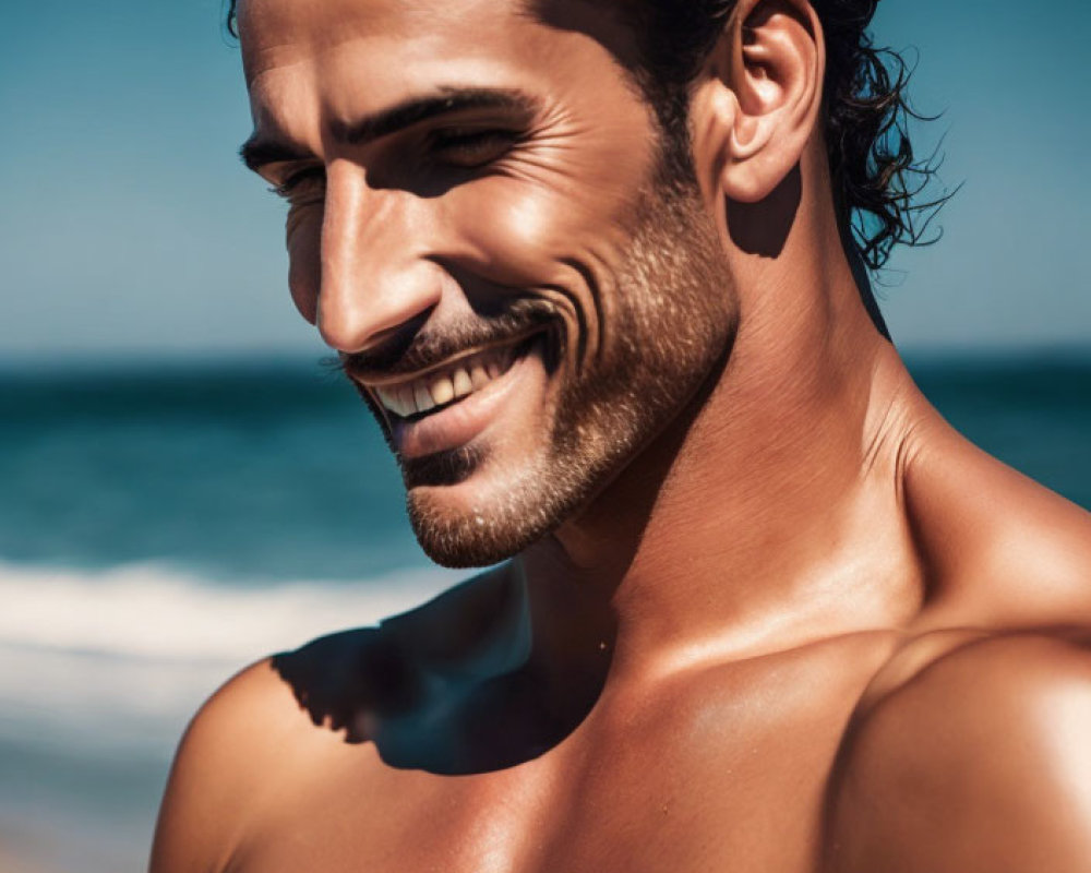 Curly-Haired Man with Shoulder Tattoo on Beach