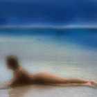 Woman in white bikini sunbathes on shallow ocean shore under blue skies