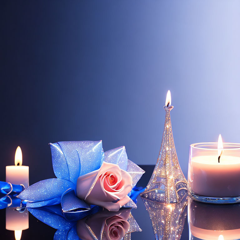 Pink rose, blue sparkle, lit candles, Eiffel Tower figure on blue backdrop