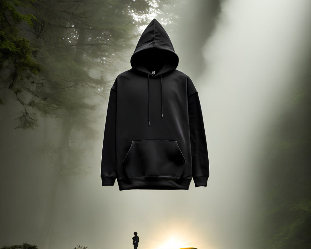Black Hoodie Suspended in Misty Forest with Person and Sunrise