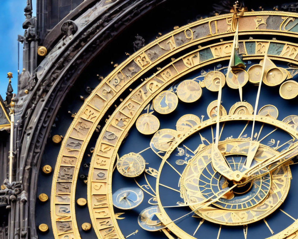 Ornate astronomical clock face with golden details and Roman numerals on blue sky
