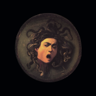 Sculpted woman's face in serpent sphere against dark backdrop