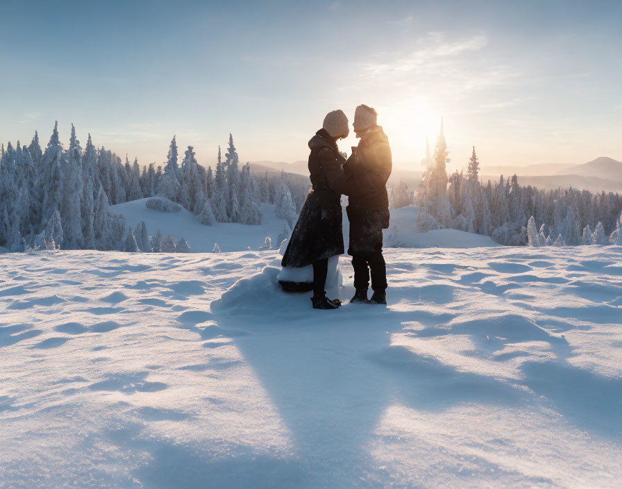 Embracing couple in snowy sunset landscape with frosted trees