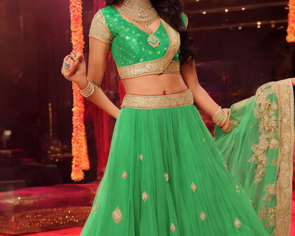 Woman in Green Embellished Lehenga with Gold Jewelry Pose
