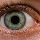 Detailed Close-Up of Blue Iris Eye with Glittery Eyelashes