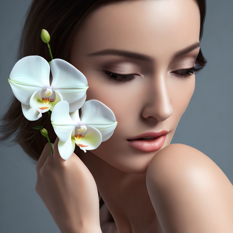 Woman with Subtle Makeup Holding White Orchid for Beauty and Elegance