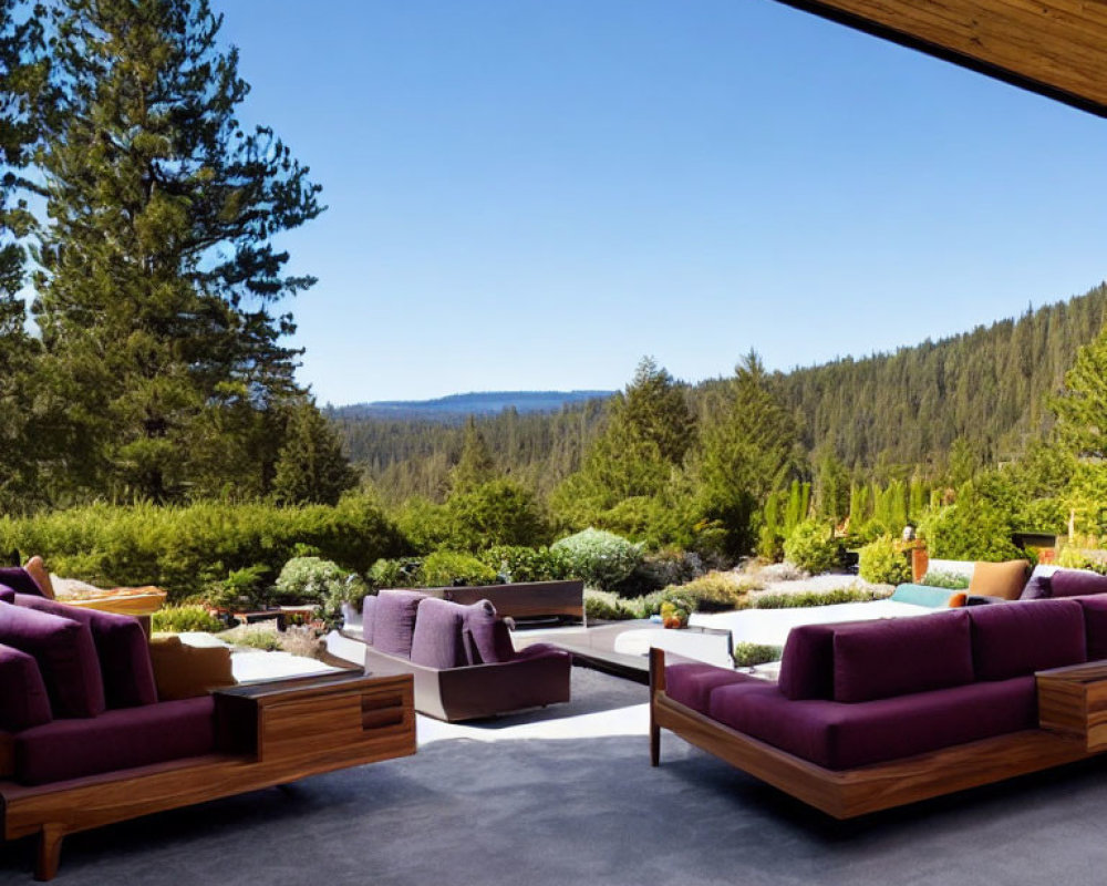 Contemporary outdoor patio with purple sofas under a roof, serene landscape view.